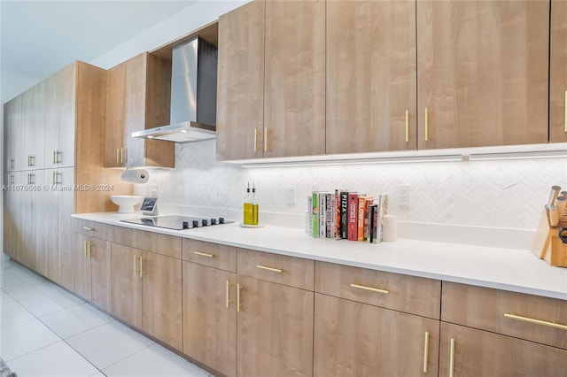 kitchen featuring black electric stovetop, light tile patterned flooring, wall chimney range hood, and tasteful backsplash