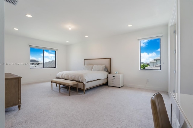 bedroom featuring light carpet