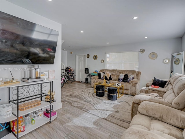 living room with light hardwood / wood-style flooring