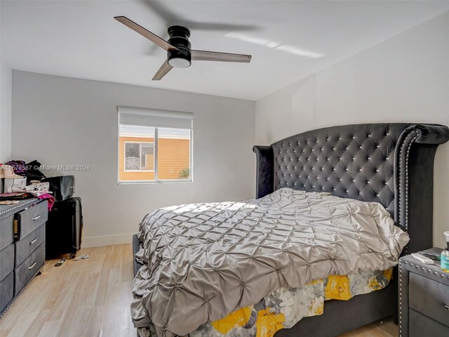 bedroom featuring light hardwood / wood-style flooring and ceiling fan