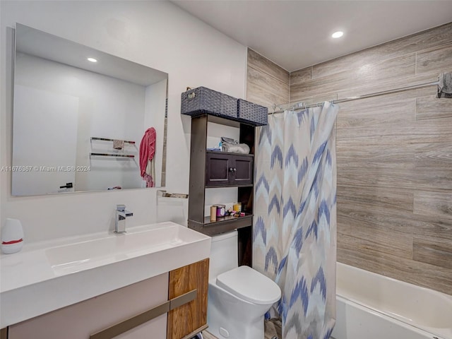 full bathroom featuring toilet, vanity, and shower / bathtub combination with curtain