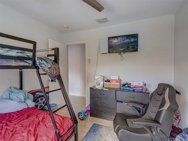 bedroom featuring light hardwood / wood-style floors and ceiling fan