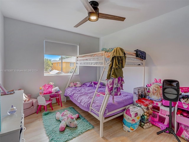 bedroom with wood-type flooring and ceiling fan