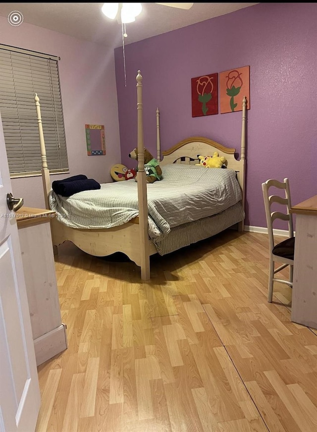 bedroom featuring ceiling fan and light hardwood / wood-style floors