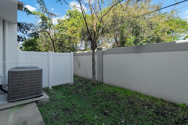 view of yard with central AC unit