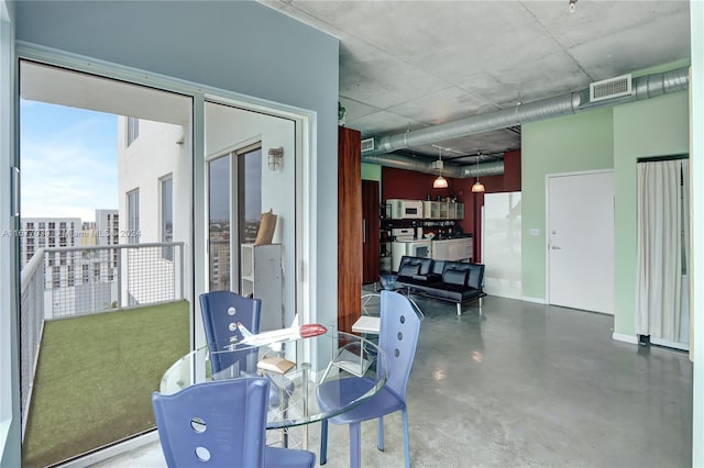 dining area with concrete floors