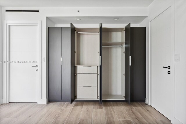 spare room featuring light hardwood / wood-style floors