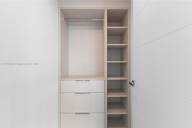 laundry area with washer and dryer and light tile patterned floors