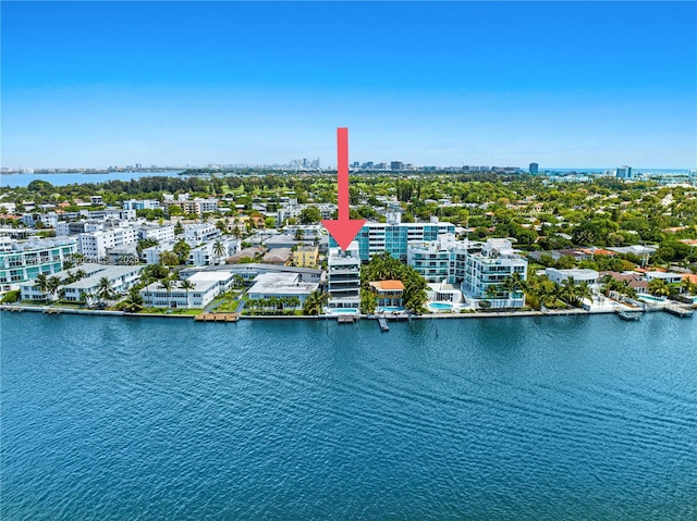 drone / aerial view with a city view and a water view