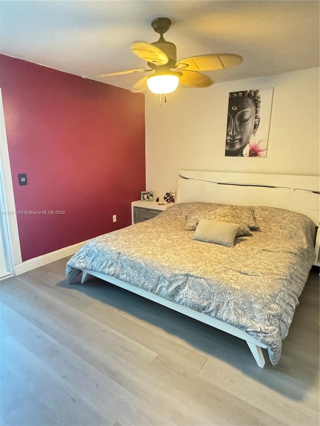 bedroom featuring ceiling fan and wood-type flooring