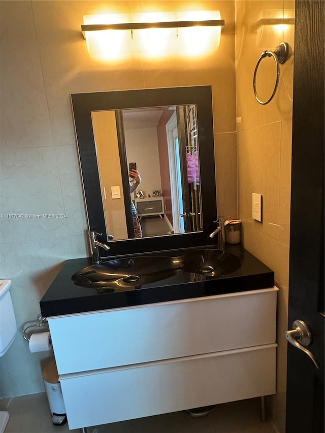 bathroom with vanity and toilet