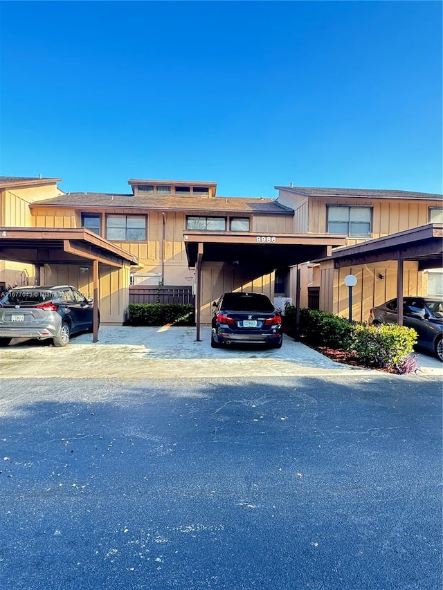 view of front of property featuring a carport