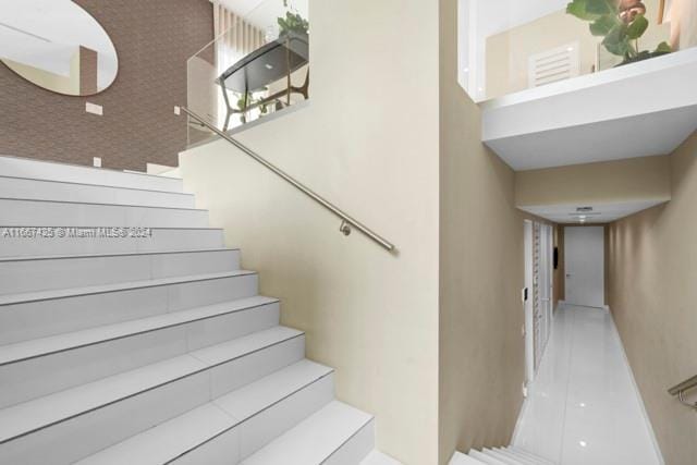 staircase with tile patterned flooring