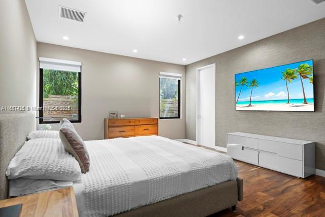 bedroom featuring dark hardwood / wood-style flooring