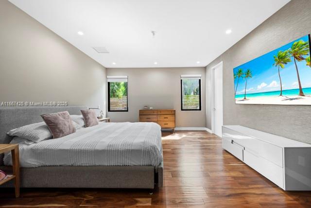 bedroom with hardwood / wood-style flooring