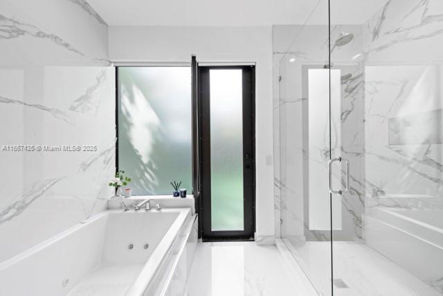 bathroom featuring vanity and a bathtub