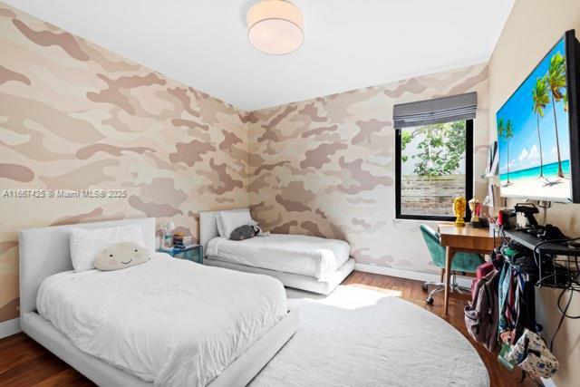 bedroom featuring a closet and wood-type flooring