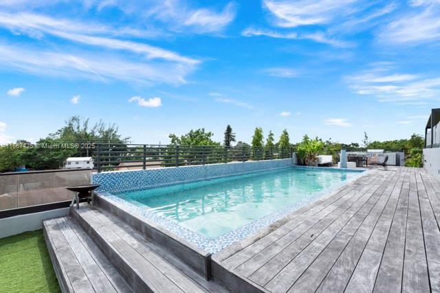 view of swimming pool with a patio