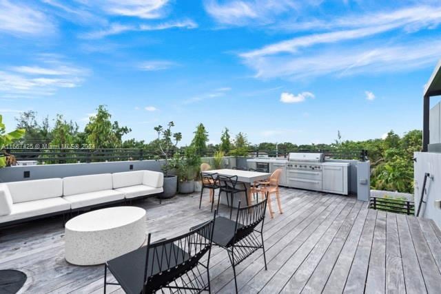 deck featuring grilling area and an outdoor hangout area