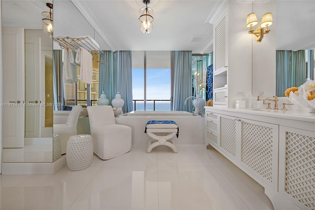 bathroom with vanity, crown molding, a water view, and tile patterned floors