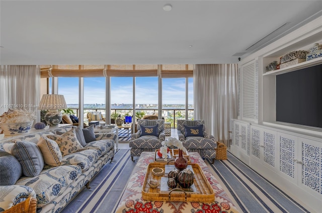 living room with floor to ceiling windows