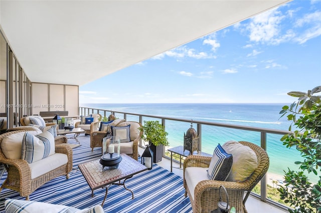 balcony with a water view and outdoor lounge area