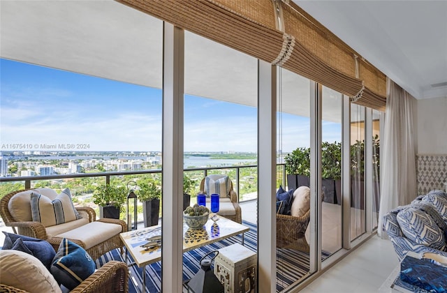 sunroom / solarium with a water view