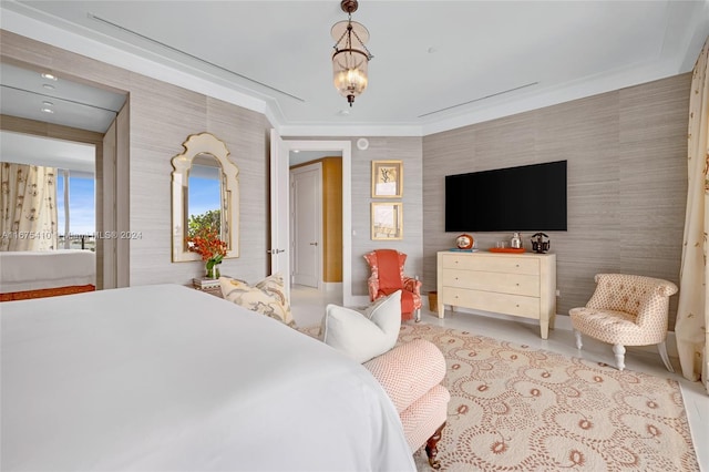 bedroom with crown molding and a chandelier