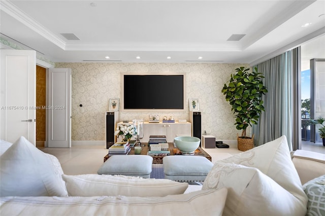 living room with crown molding and a tray ceiling