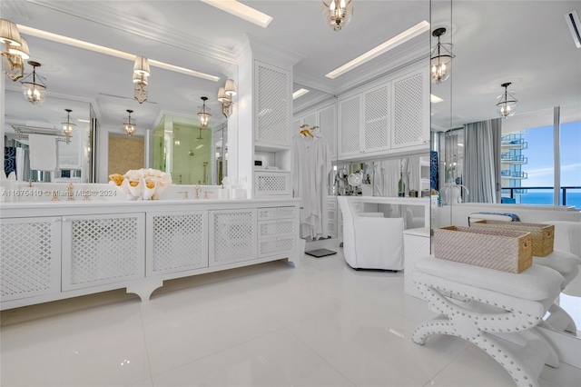 bathroom featuring vanity, crown molding, a water view, and tile patterned flooring