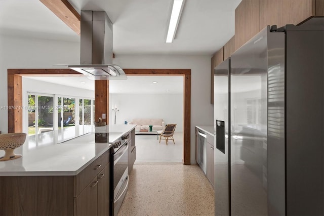 kitchen with island range hood, dark brown cabinetry, and stainless steel appliances