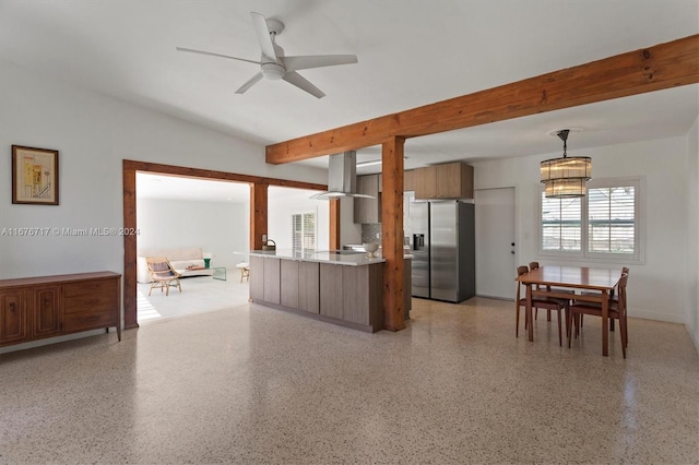 kitchen featuring kitchen peninsula, ventilation hood, ceiling fan, stainless steel fridge with ice dispenser, and hanging light fixtures