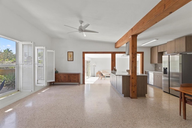 kitchen featuring kitchen peninsula, backsplash, ceiling fan, lofted ceiling with beams, and stainless steel fridge with ice dispenser