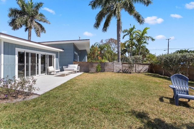 view of yard with outdoor lounge area and a patio