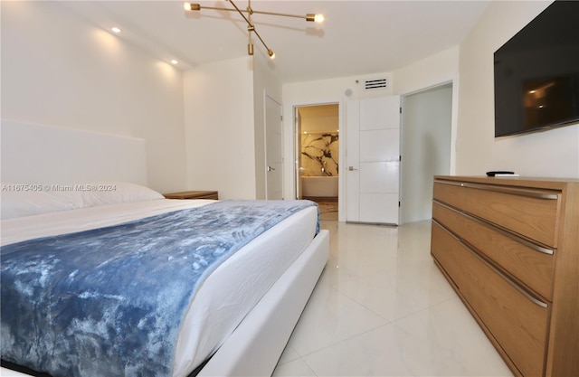 tiled bedroom featuring connected bathroom