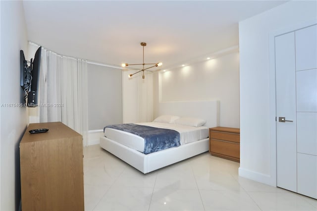 bedroom with a chandelier