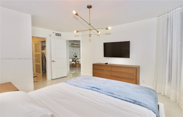 bedroom with a notable chandelier