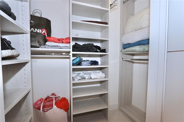 spacious closet featuring tile patterned flooring