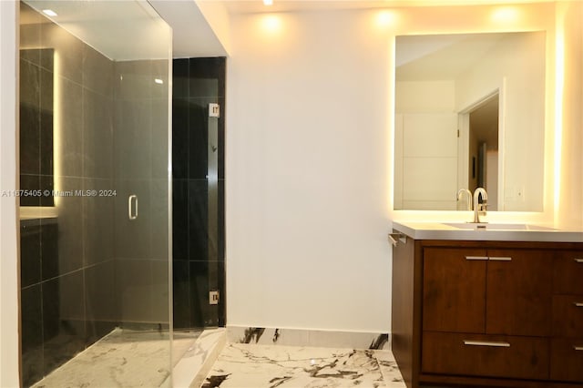 bathroom featuring vanity and an enclosed shower