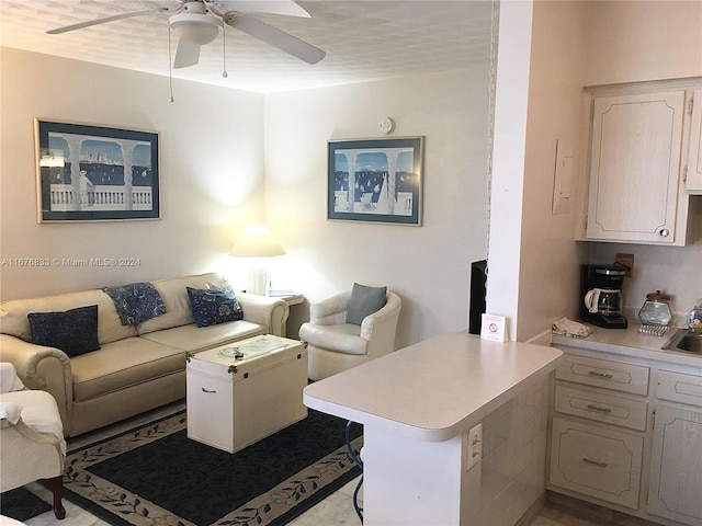 living room featuring ceiling fan