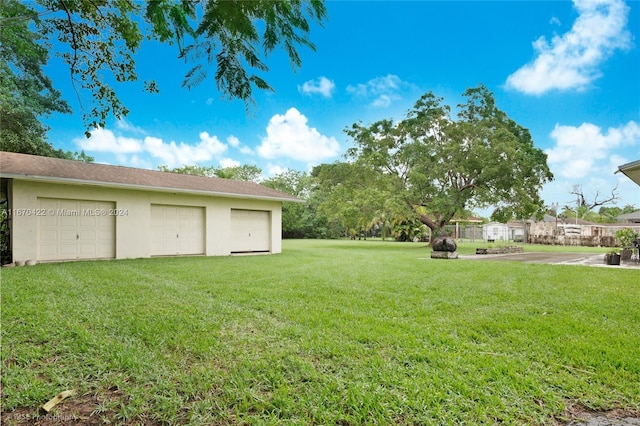 view of yard with a garage