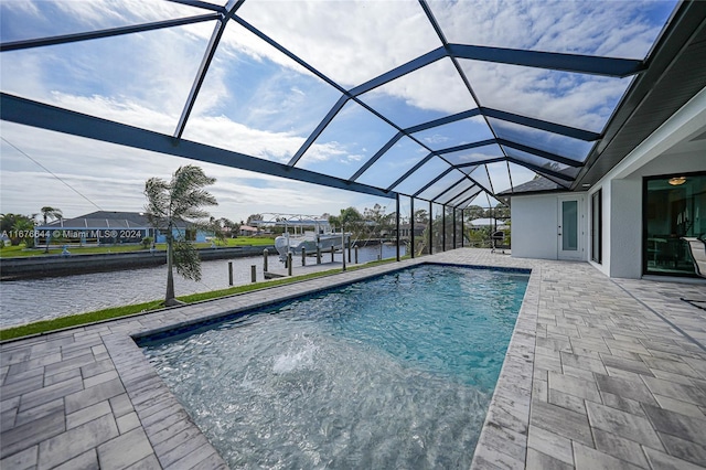 view of swimming pool featuring a boat dock, a water view, a patio, and glass enclosure