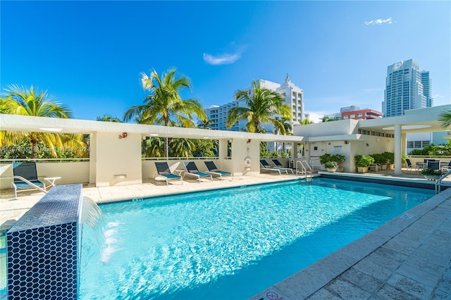 view of pool featuring a patio and pool water feature