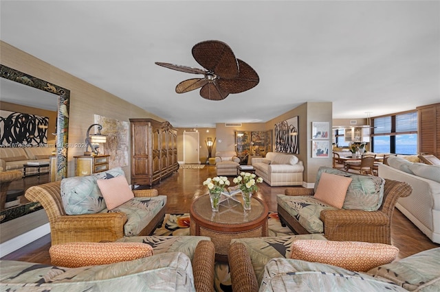 living room featuring ceiling fan and dark wood-type flooring