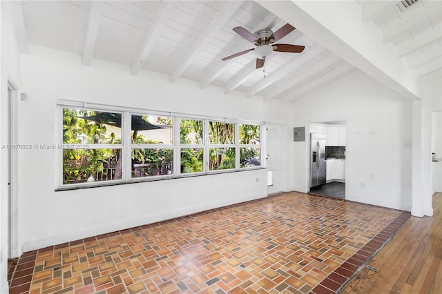 empty room featuring high vaulted ceiling, a ceiling fan, baseboards, and beam ceiling