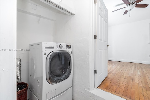 laundry area with washer / clothes dryer, cabinet space, a ceiling fan, baseboards, and hardwood / wood-style flooring