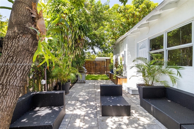 view of patio with fence and an outdoor living space