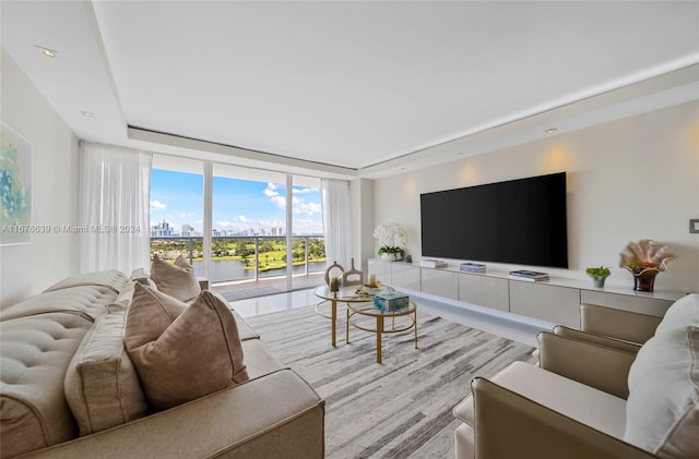 living room featuring a wall of windows