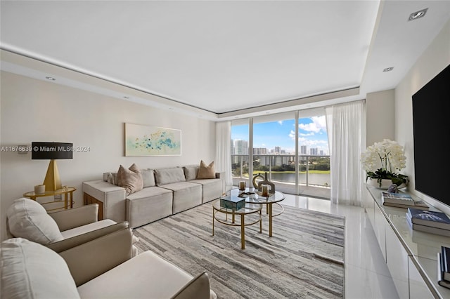 tiled living room with floor to ceiling windows