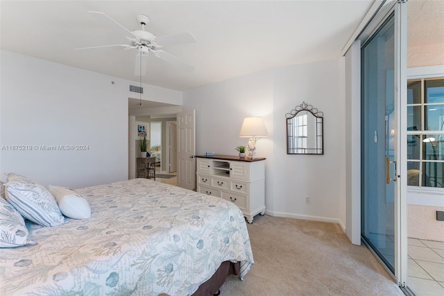 carpeted bedroom featuring multiple windows and ceiling fan